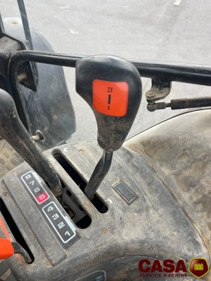 Tracteur agricole New Holland TS 100 avec chargeur 