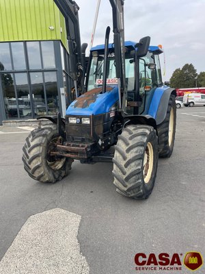Tracteur agricole New Holland TS 100 avec chargeur 