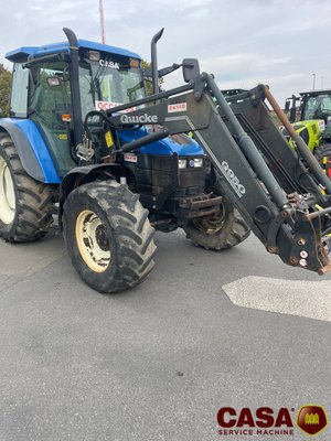Tracteur agricole New Holland TS 100 avec chargeur 