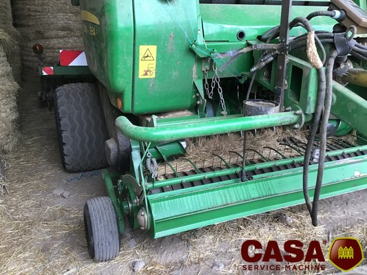 Presse à balles rondes John Deere 864 rotoflow