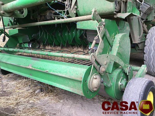 Presse à balles rondes John Deere 864 rotoflow